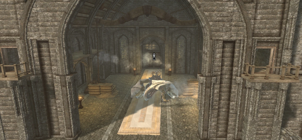 The player - a dragon - is stood beneath a set of massive stocks intended for trapping a dragon